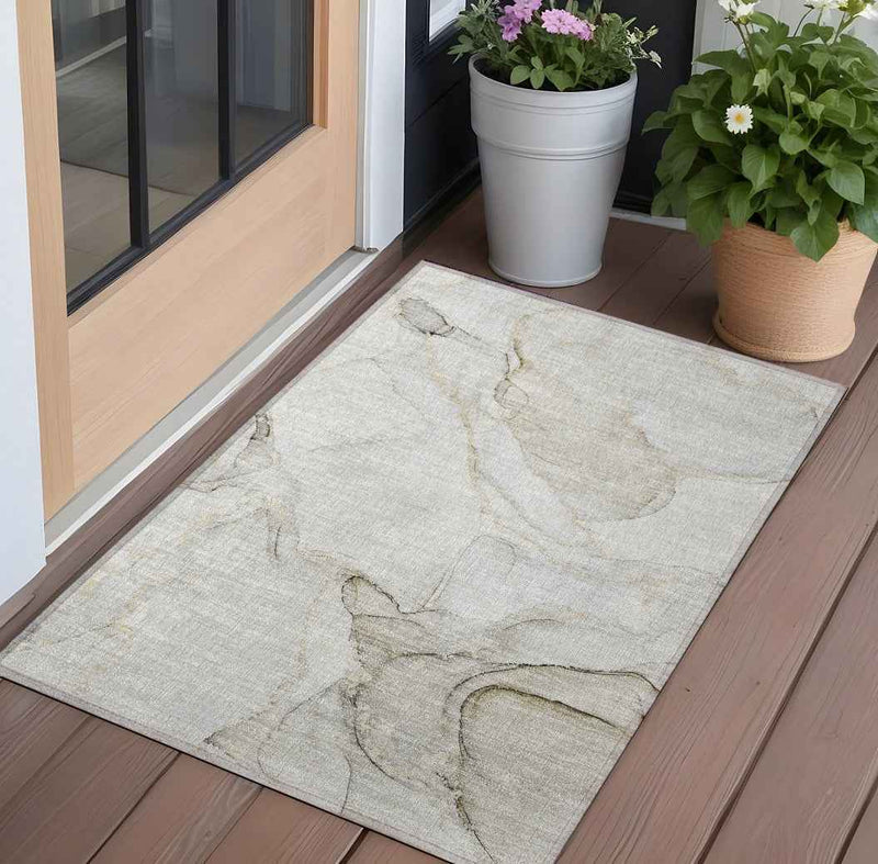 2' X 3' Beige and Ivory Abstract Washable Indoor Outdoor Area Rug