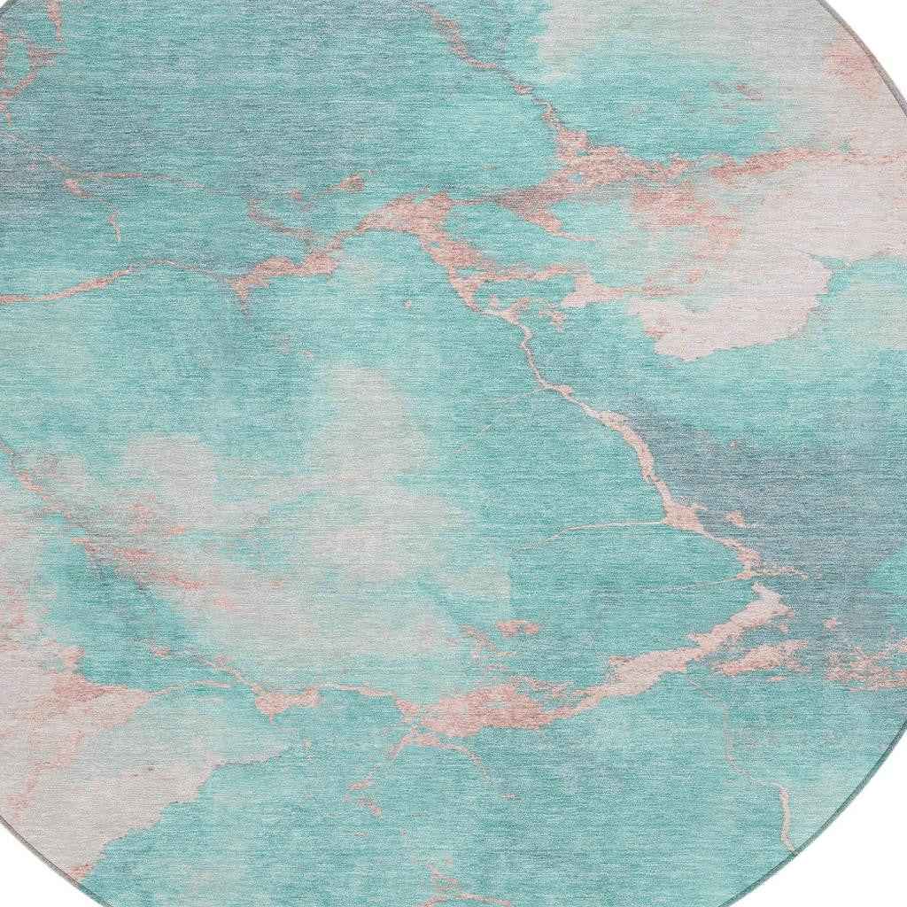 8' Teal Blue Peach And Ivory Round Abstract Washable Indoor Outdoor Area Rug