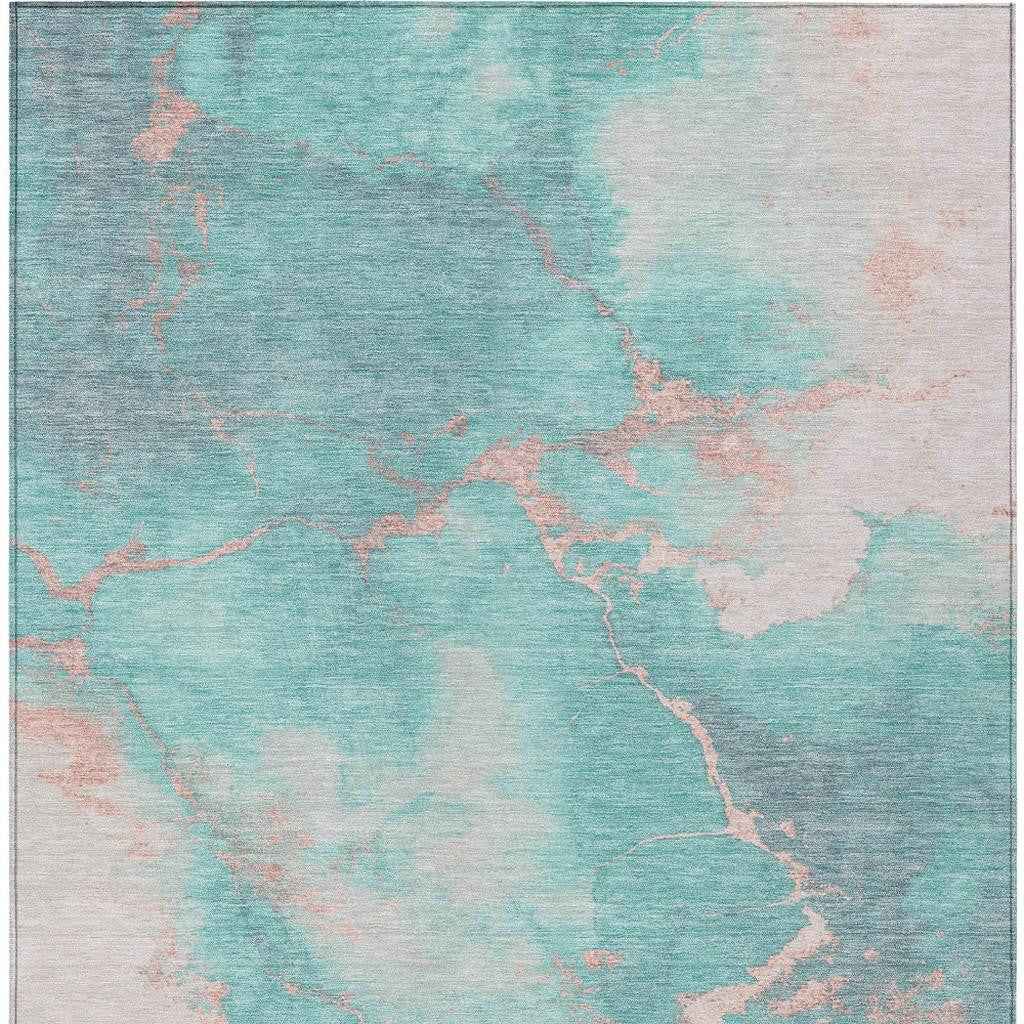9' X 12' Teal Blue Peach And Ivory Abstract Washable Indoor Outdoor Area Rug
