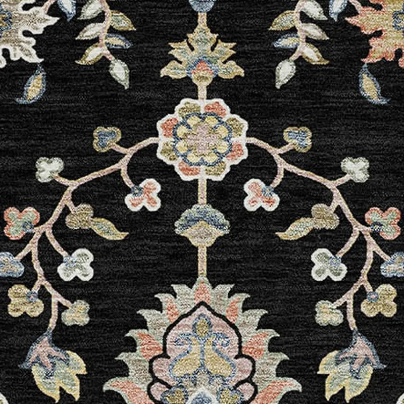 Black floral area rug with intricate multicolored patterns, made from soft plush material for a luxurious feel.
