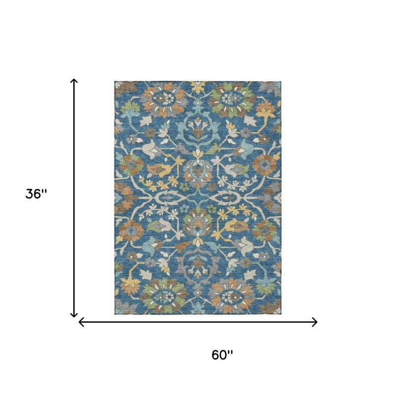 Multicolor floral pattern area rug, 36"x60", featuring blue, gold, and earthy tones, crafted from soft polyester.