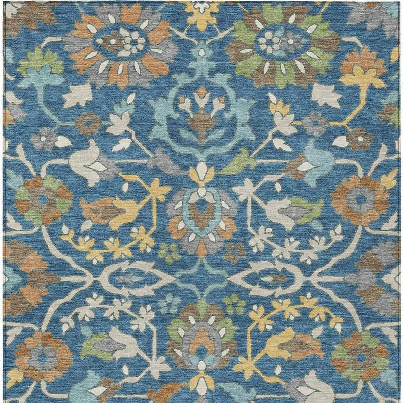 Blue floral area rug featuring intricate patterns and a soft, textured finish, perfect for modern and vintage decor.