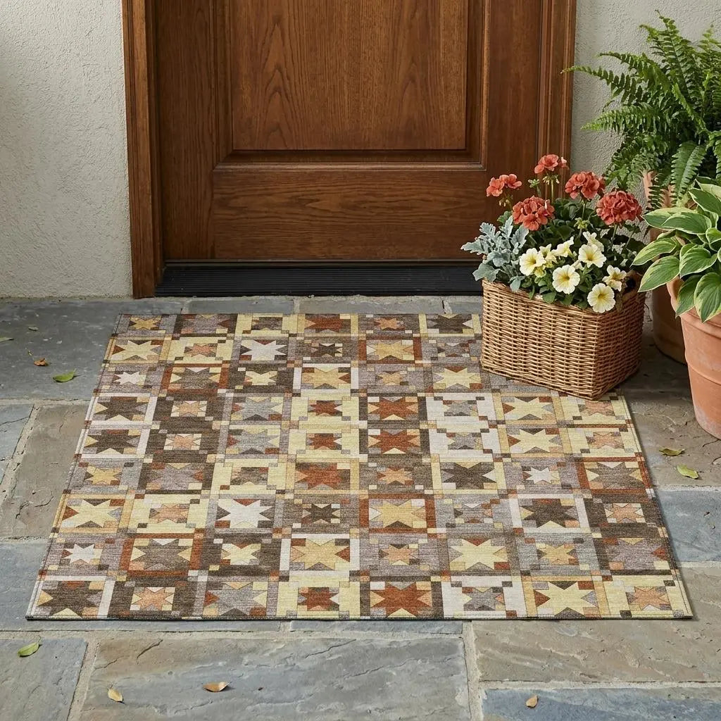 Colorful patterned outdoor rug in earthy tones of brown, yellow, and gray, perfect for entryways and porches.