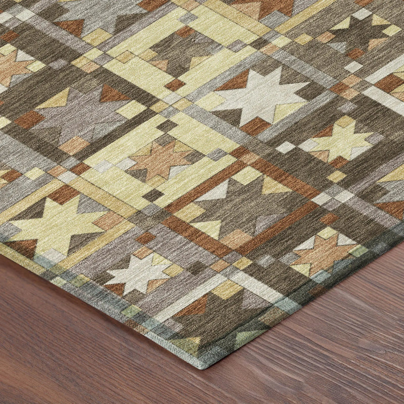 Multicolored geometric patterned area rug in brown, cream, and mustard, adding a cozy touch to any room.