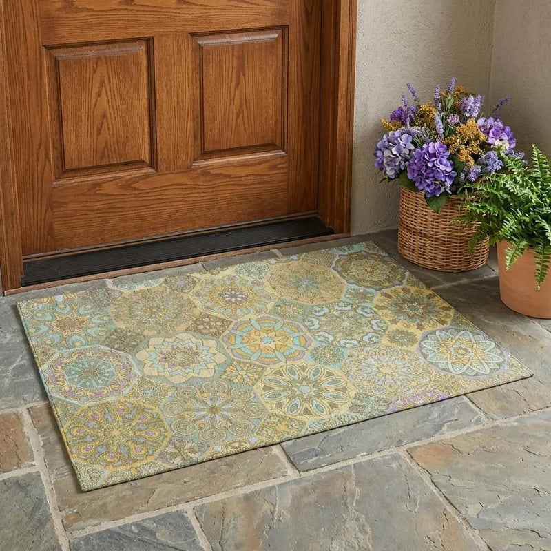 Colorful geometric patterned doormat in pastel tones, made from durable synthetic material, perfect for entryways.