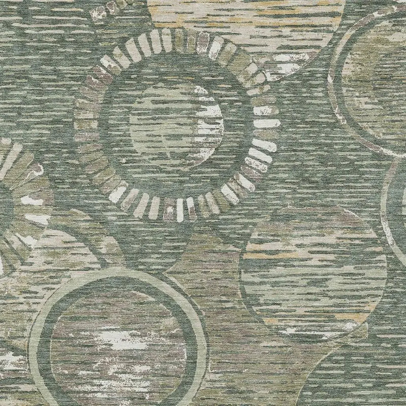 Vintage-inspired area rug featuring green and beige circular patterns on a textured background.