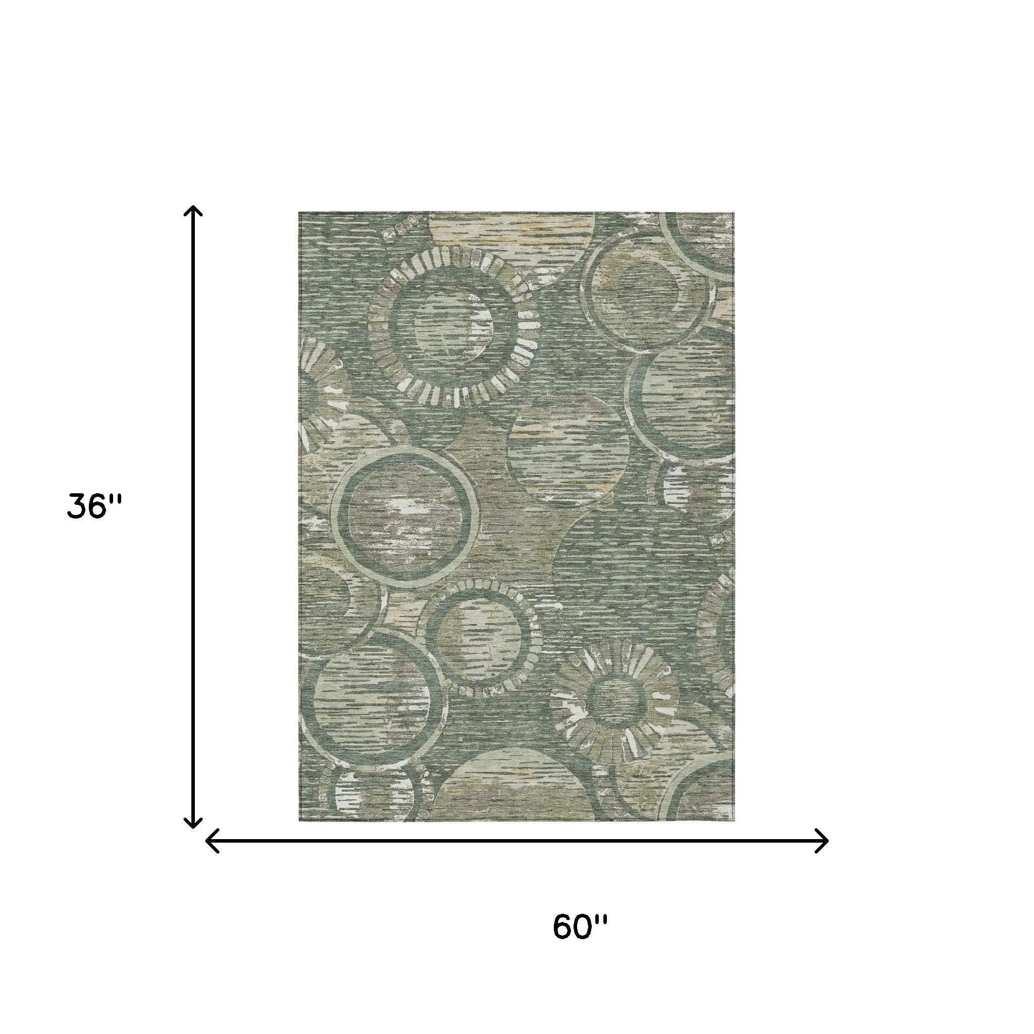 Green abstract circular pattern area rug, 36"x60", made of durable polyester for modern home decor.
