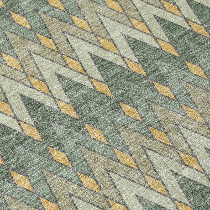 Geometric patterned area rug in green, yellow, and grey, featuring diamond shapes for a modern look.