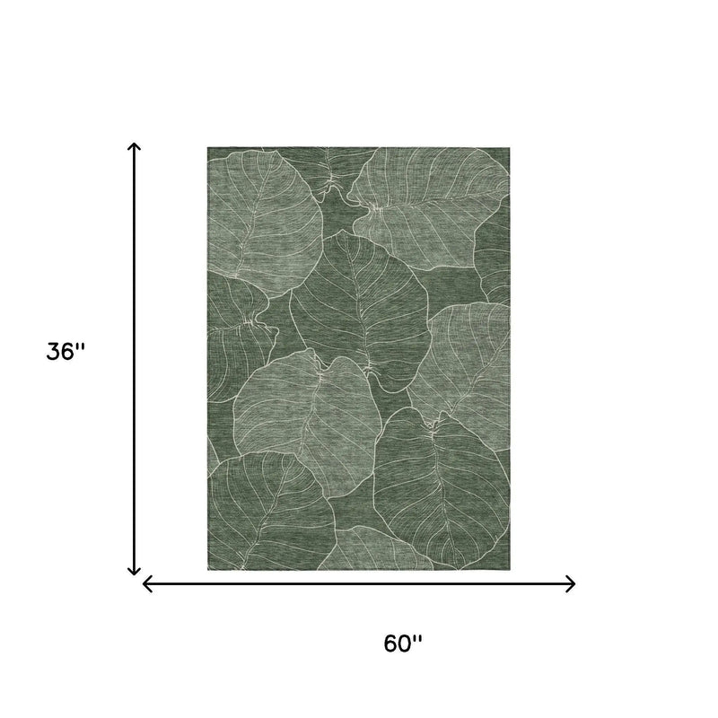 Green leaf-patterned area rug, 36"x60", made of soft durable fibers, perfect for modern home decor.