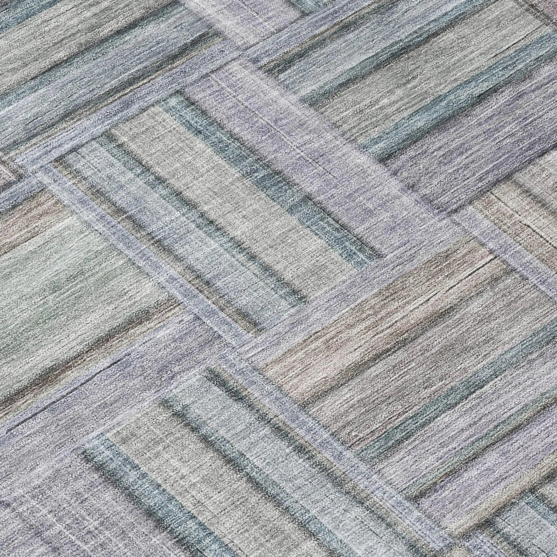 Light purple and gray striped area rug, woven in a modern, geometric pattern from soft, durable fibers.