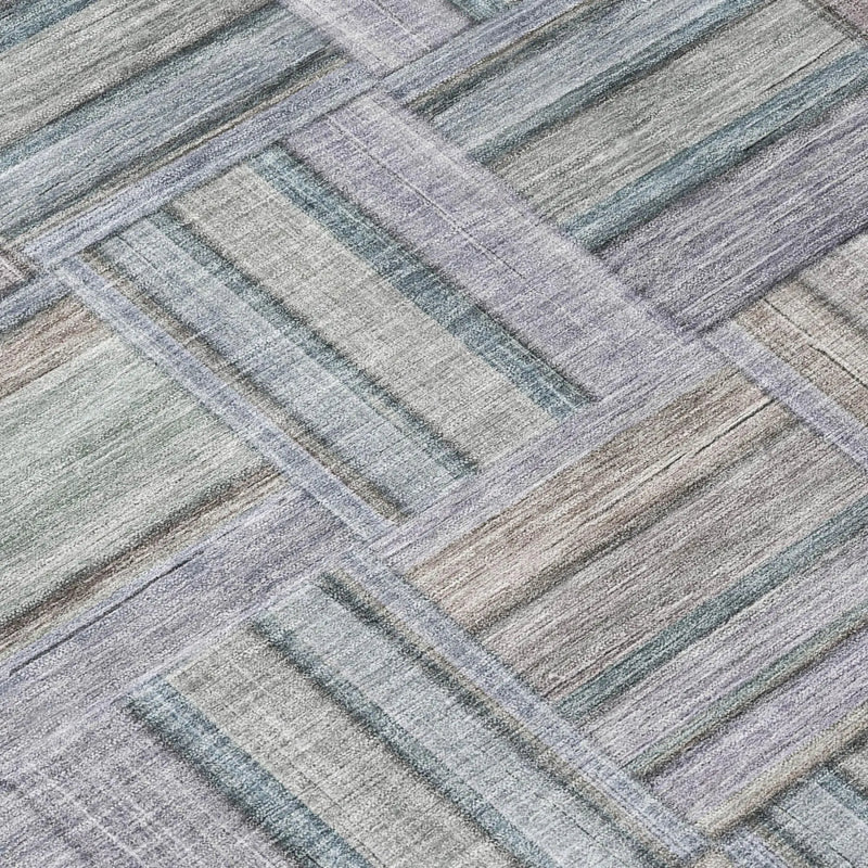 Light purple and gray striped area rug, woven in a modern, geometric pattern from soft, durable fibers.