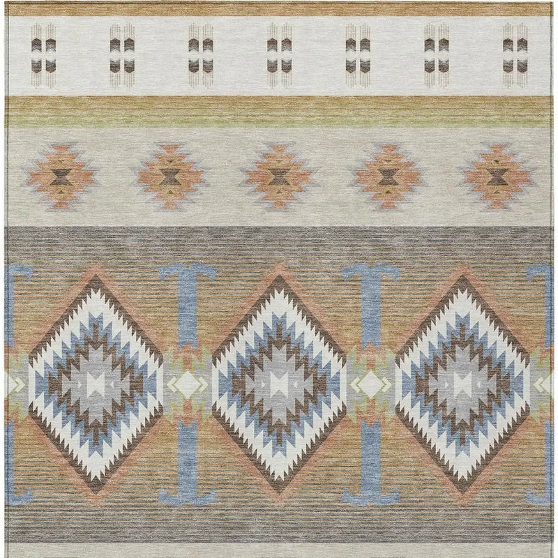 Multicolor geometrical area rug in earthy tones, featuring a tribal-inspired design and soft, durable fibers.