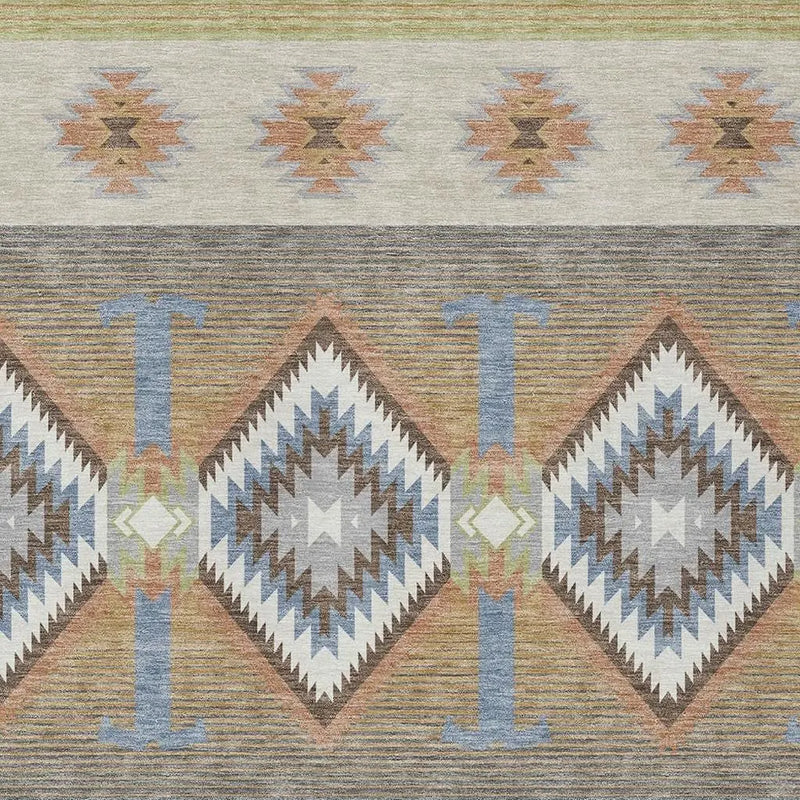 Colorful southwestern-style woven fabric featuring geometric patterns in earth tones, blues, and subtle pastels.