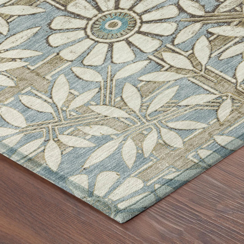 Blue and ivory floral patterned area rug with leafy details, perfect for adding elegance to any room.