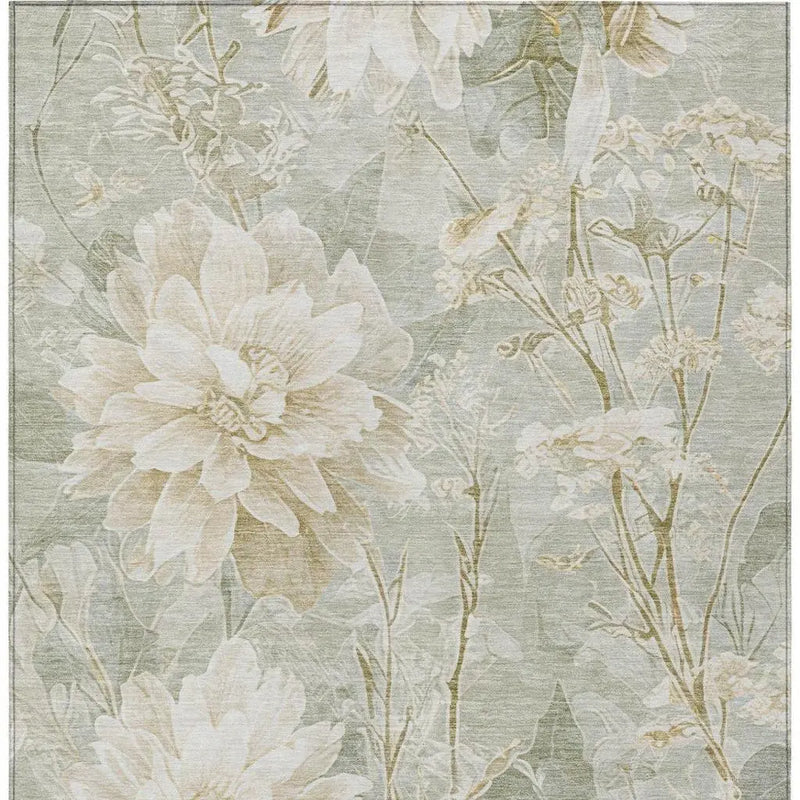 Cream floral area rug on a soft green background, featuring elegant botanical patterns in a modern style.