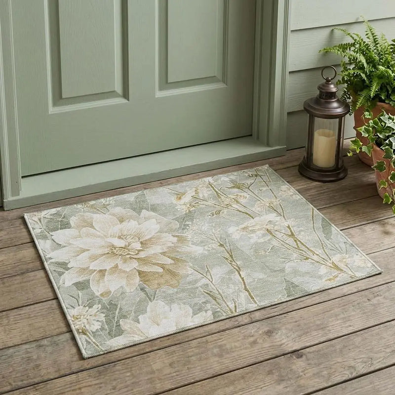 Floral patterned outdoor rug in soft mint green and beige, perfect for entryways and patios.