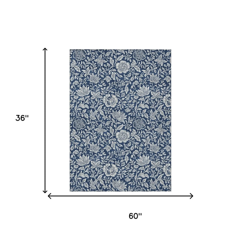 Navy blue floral patterned fabric, 60x36 inches, ideal for upholstery and decor projects.