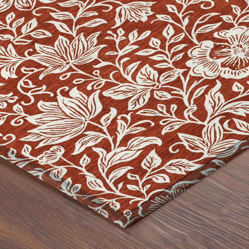 Rustic terracotta floral area rug with white botanical pattern, perfect for cozy home decor.