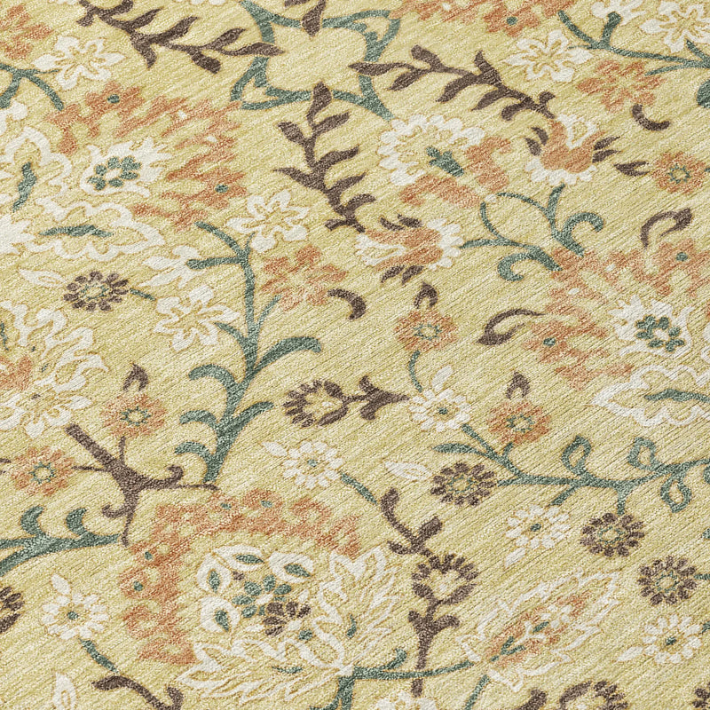 Floral-patterned yellow area rug with intricate designs in beige, orange, and brown. Perfect for cozy living spaces.