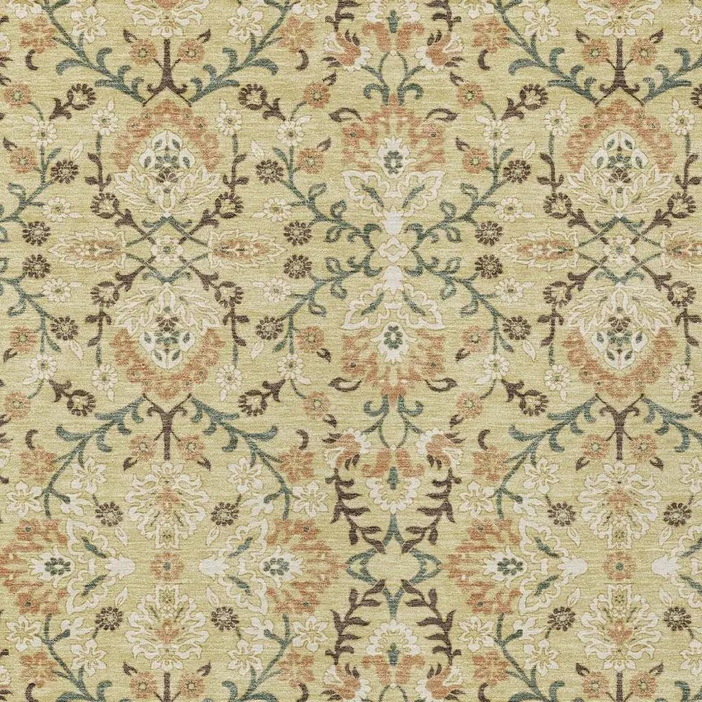 Vintage floral area rug in soft green, cream, and rust hues, featuring intricate patterns and a plush texture.