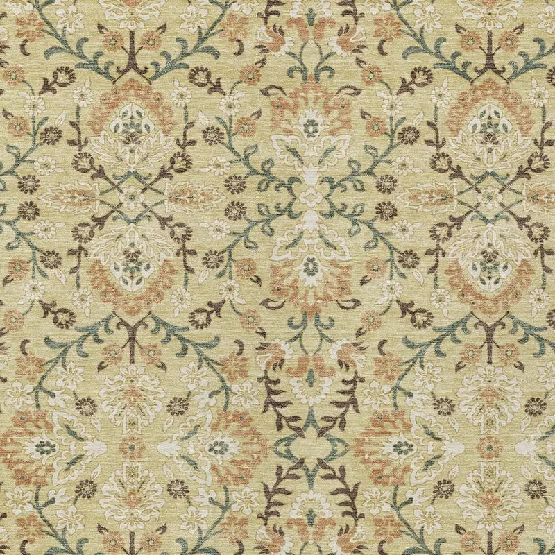 Vintage floral area rug in soft green, cream, and rust hues, featuring intricate patterns and a plush texture.