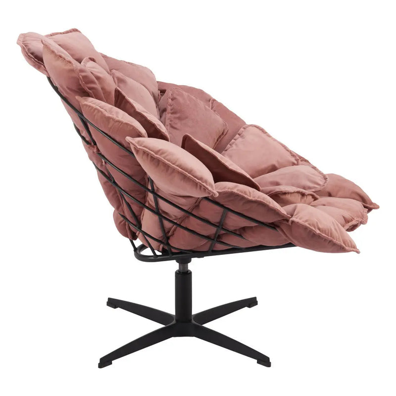 Blush pink padded lounge chair with a black metal frame, modern design ideal for stylish home decor.