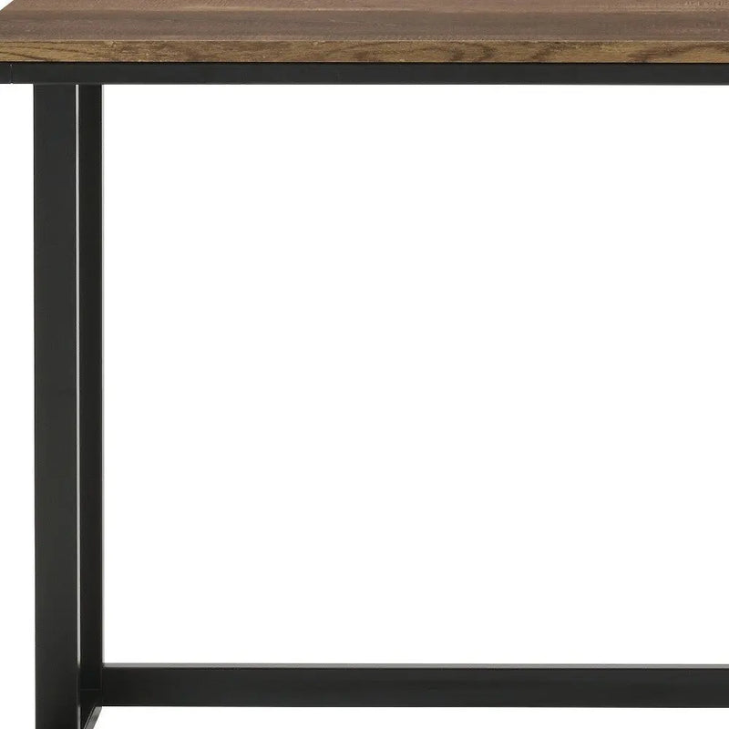 Brown wooden tabletop with black metal frame, modern industrial style dining table. Perfect for contemporary interiors.
