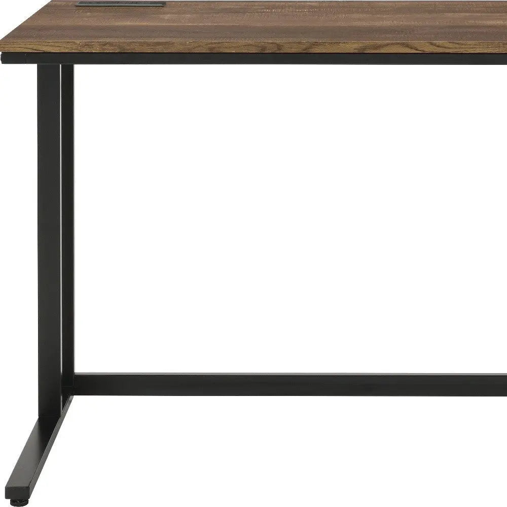 Modern brown wood desk with a black metal frame, ideal for home office or study.