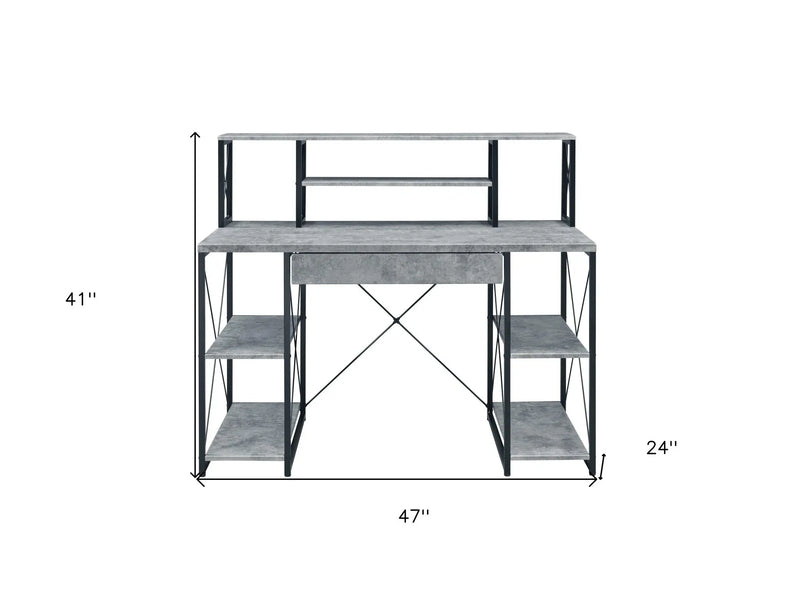 Gray industrial-style desk with black metal frame and shelves, dimensions 47" x 24" x 41". Perfect for modern spaces.