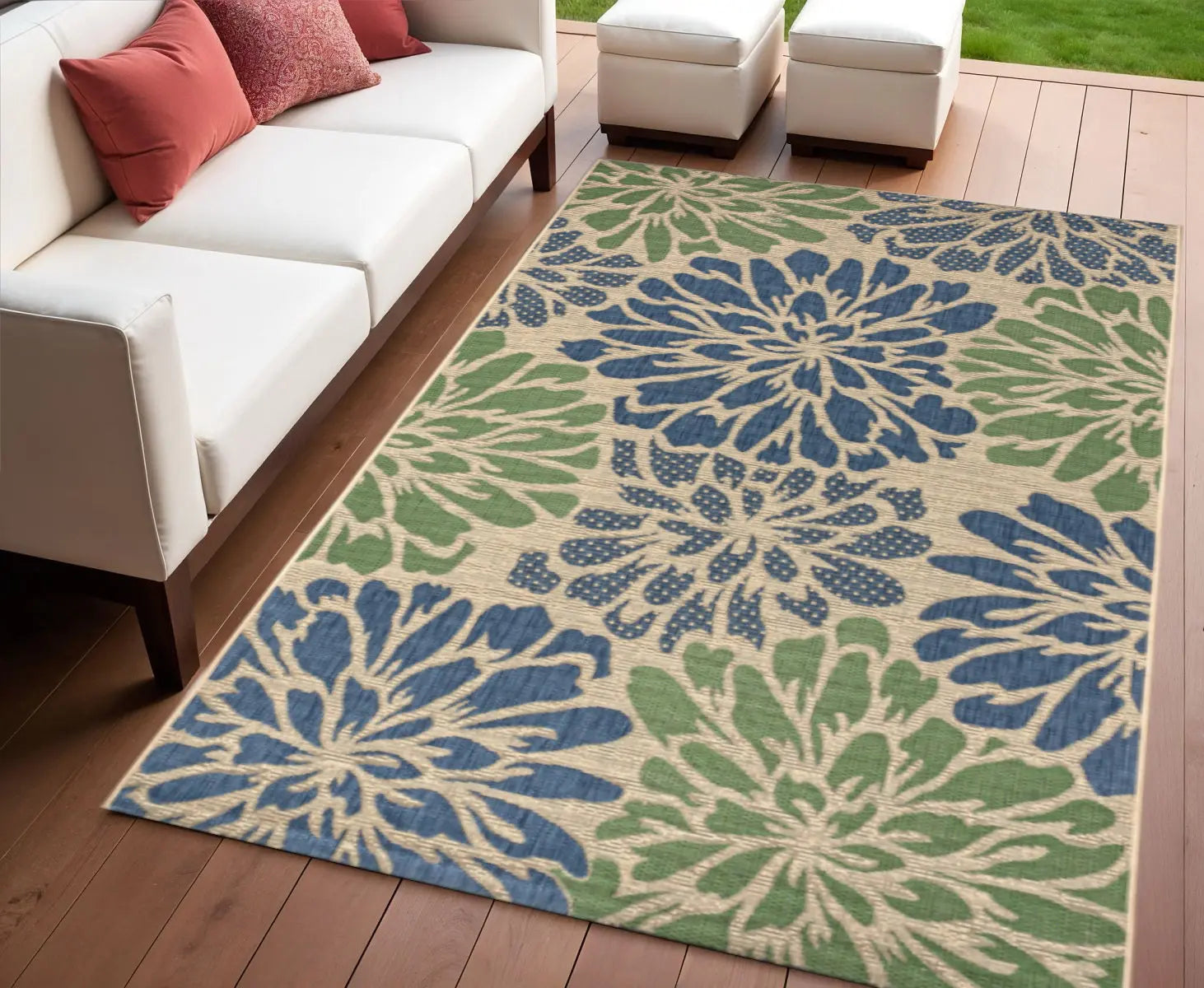 Floral area rug in blue and green on beige, perfect for outdoor living spaces, enhancing style and comfort.