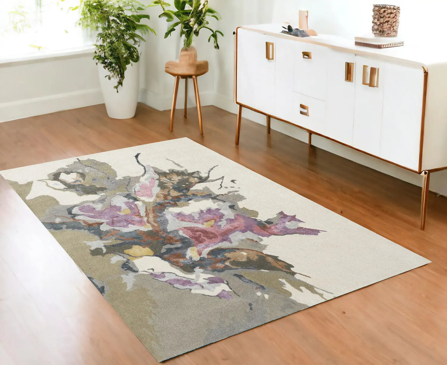 Abstract floral area rug in soft beige, featuring purple and brown hues, ideal for modern home decor.