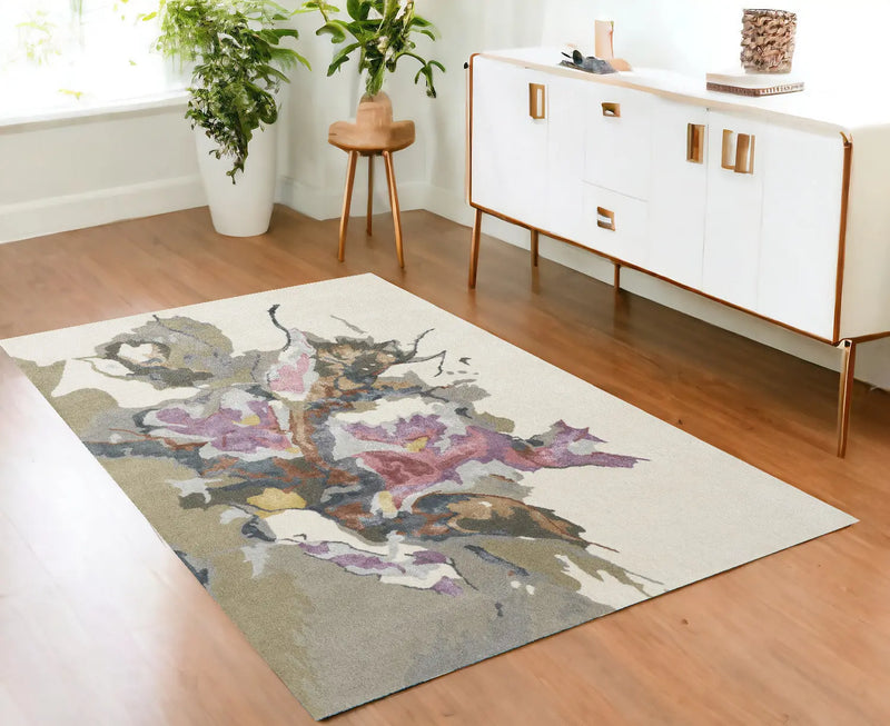 Abstract floral area rug in soft beige, featuring purple and brown hues, ideal for modern home decor.