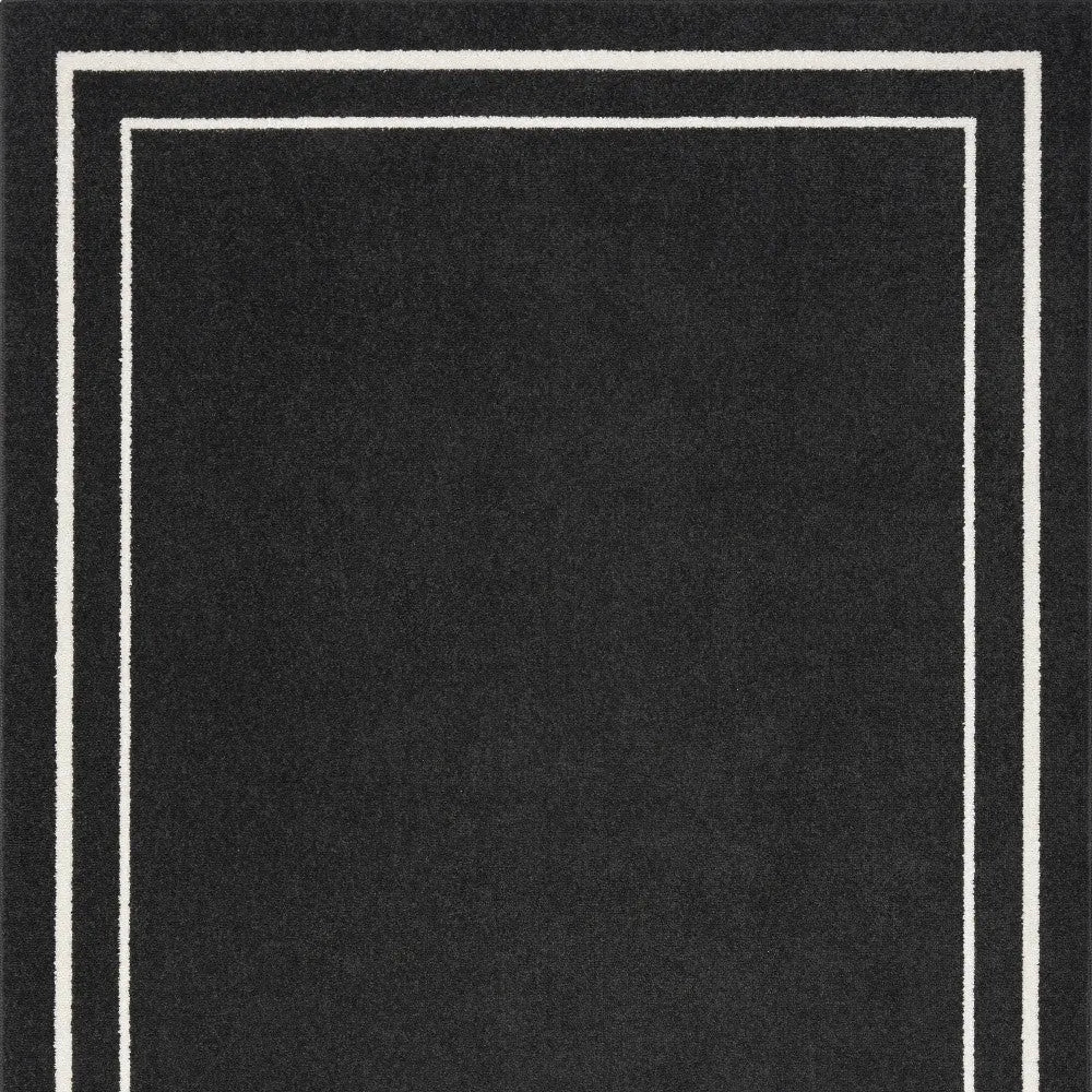 5' X 7' Black And Ivory Indoor Outdoor Area Rug Homeroots Outdoor