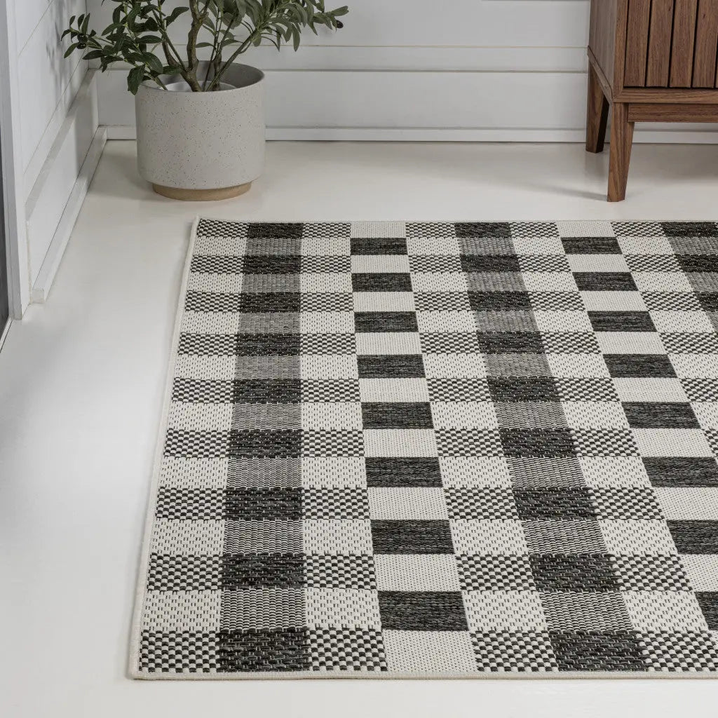 5' X 8' Black And Cream Geometric Indoor Outdoor Area Rug - GreatEagleInc