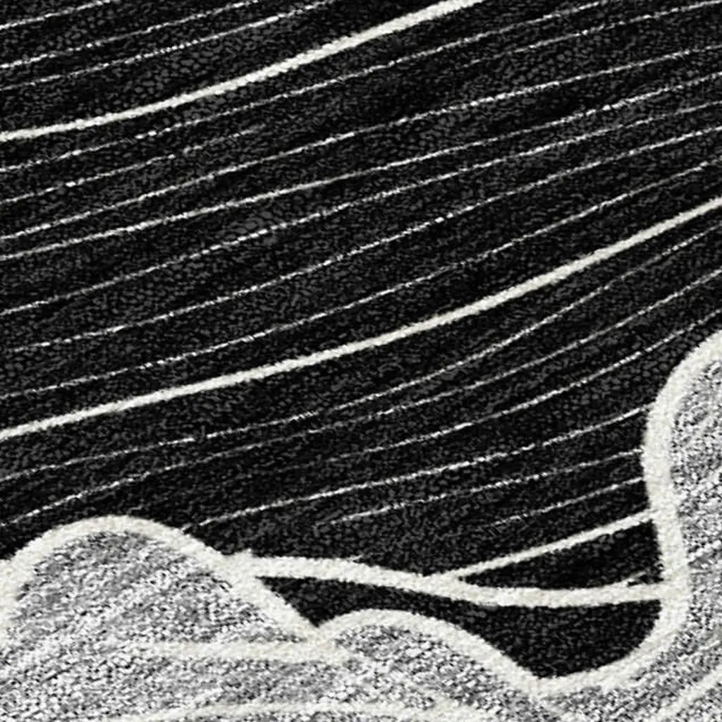 Black and white abstract area rug with wave pattern, crafted from soft synthetic fibers for modern decor.