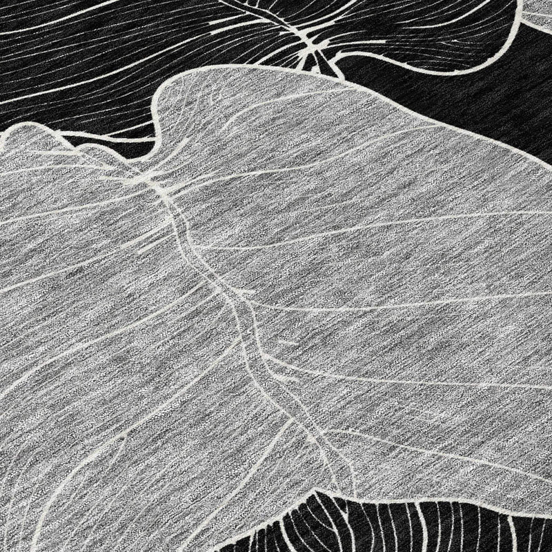Gray and white abstract leaf design carpet on black background, soft texture, modern style for contemporary decor.