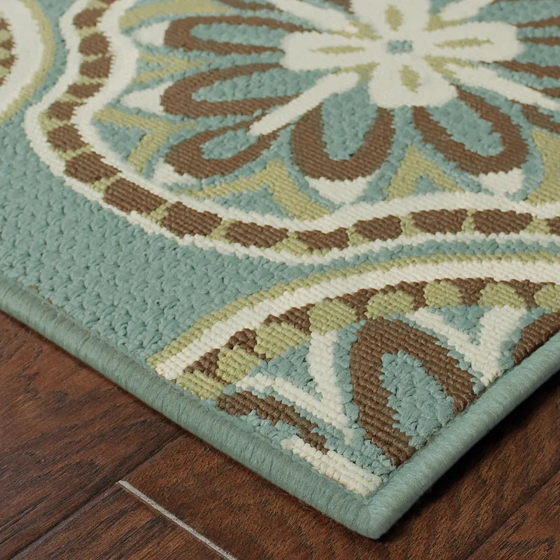 Teal and green patterned area rug with floral design and brown accents, perfect for modern decor.