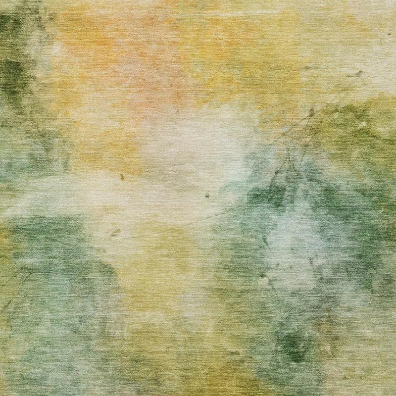 Handcrafted abstract area rug in muted green, yellow, and orange hues, featuring a soft wool blend texture.