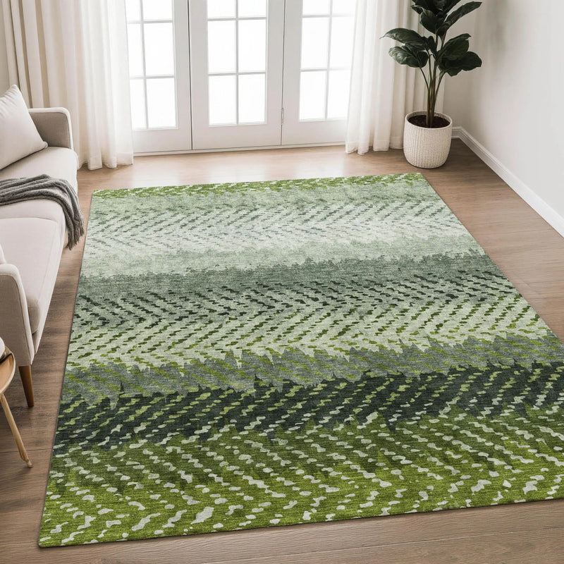 Green geometric patterned area rug made of soft fibers, perfect for modern living spaces.