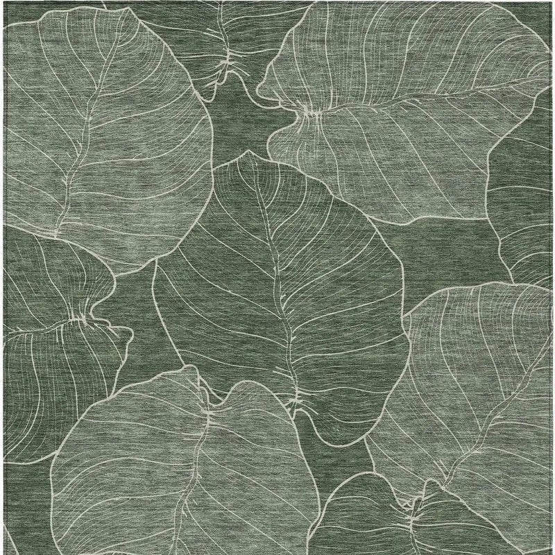 Green leaf-patterned area rug with intricate white line detailing, perfect for modern home decor.