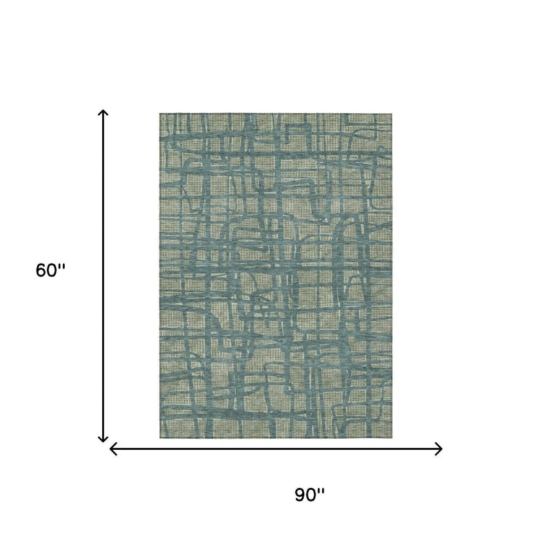 Blue and beige abstract patterned area rug, 90" x 60", soft fabric, perfect for modern living spaces.