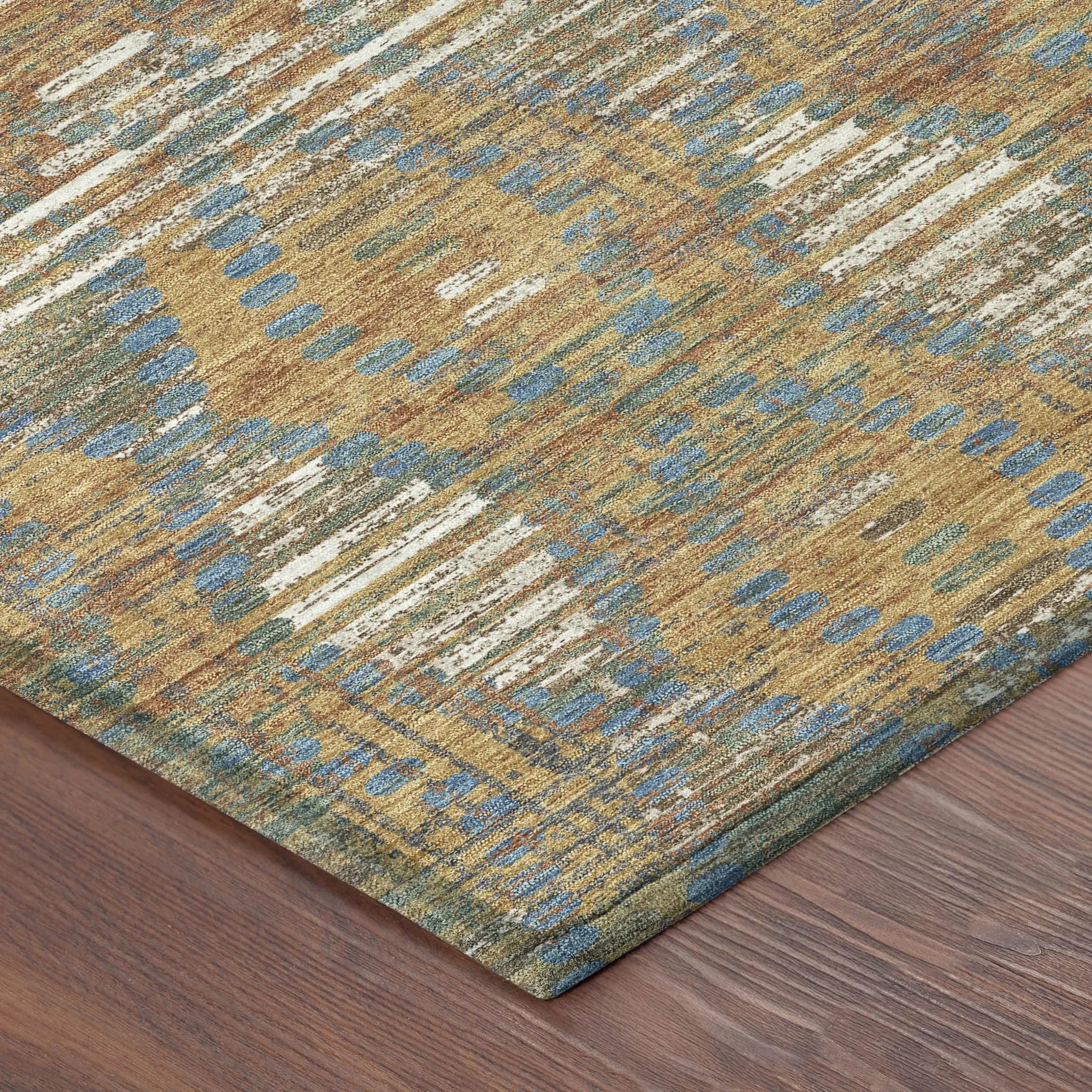 Multi-colored area rug featuring yellow, blue, and green patterns; soft, durable synthetic material.