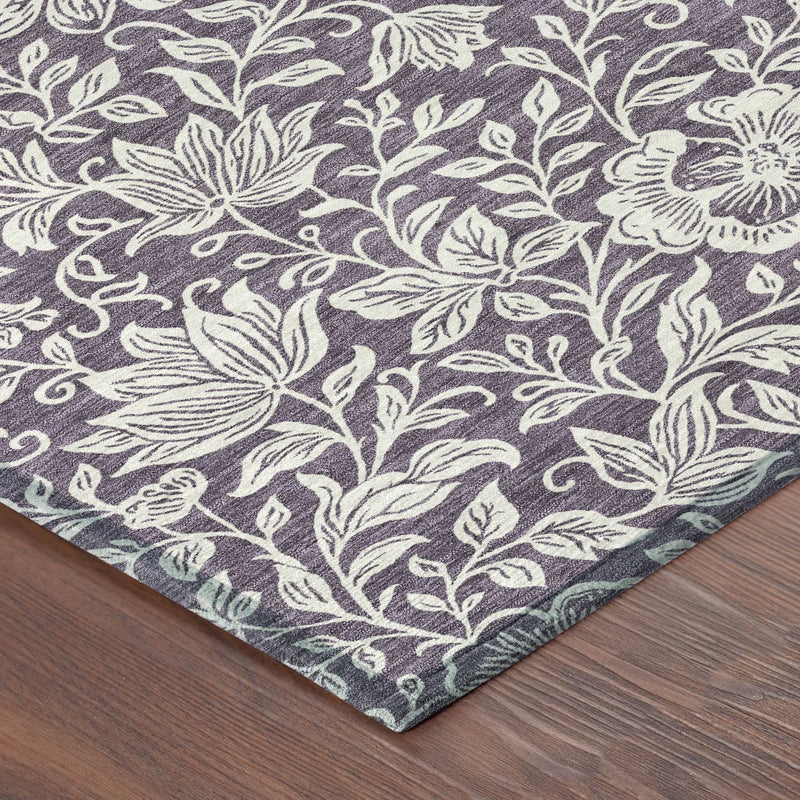 Purple floral-patterned area rug with cream designs, perfect for adding elegance to any room.