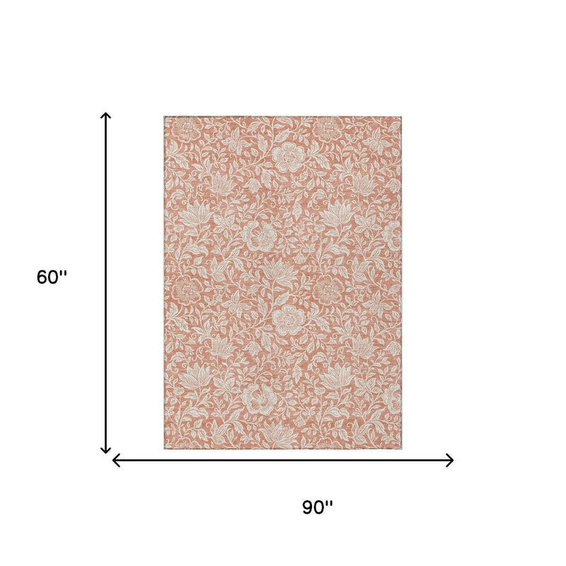 Floral patterned peach tablecloth, 90"x60", elegant cotton design for dining and events.