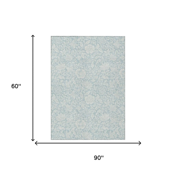 Light blue floral pattern area rug, 90" x 60", made of soft, durable polyester, perfect for contemporary decor.