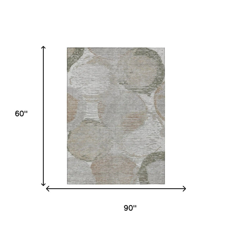 Gray area rug with abstract beige and green circular patterns, measuring 90" x 60" for modern decor.