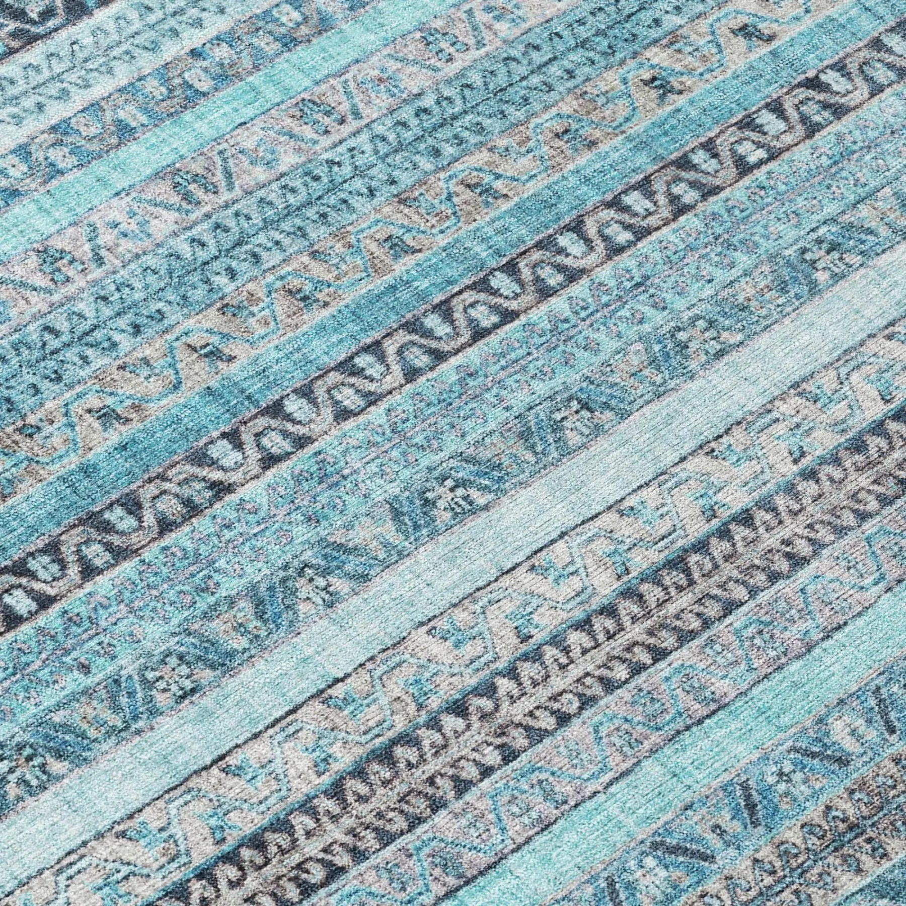Blue patterned area rug with geometric designs in soft, durable material, perfect for modern home decor.