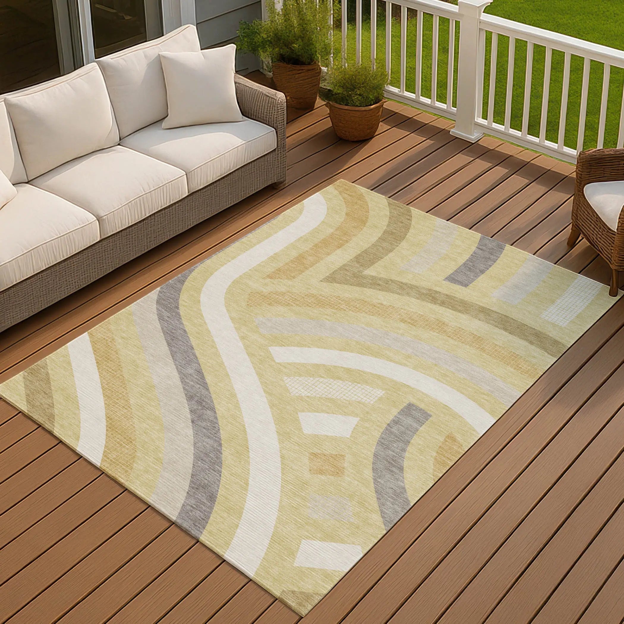 Cream and beige abstract area rug with gray accents, perfect for outdoor or indoor use, adds warmth to any space.