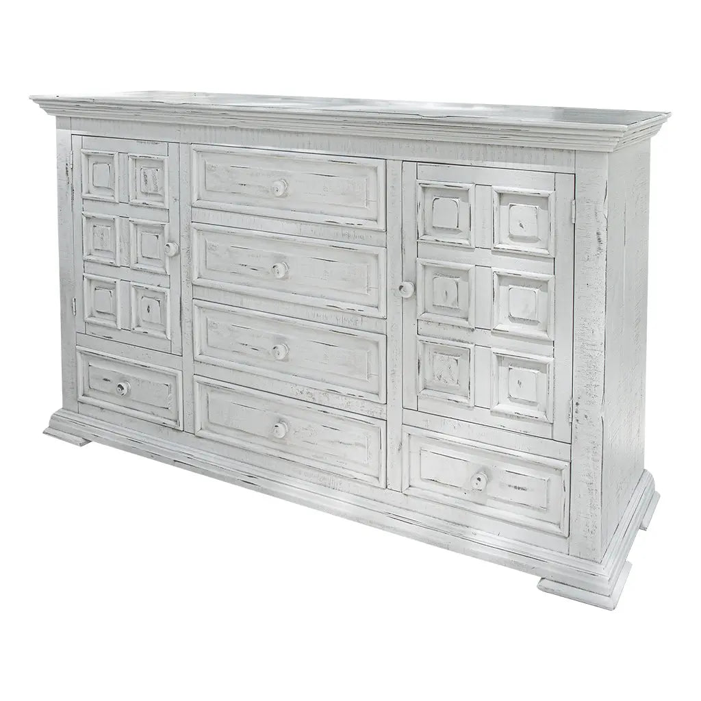 White distressed wood sideboard with six drawers and two cabinet doors, featuring a vintage decorative style.