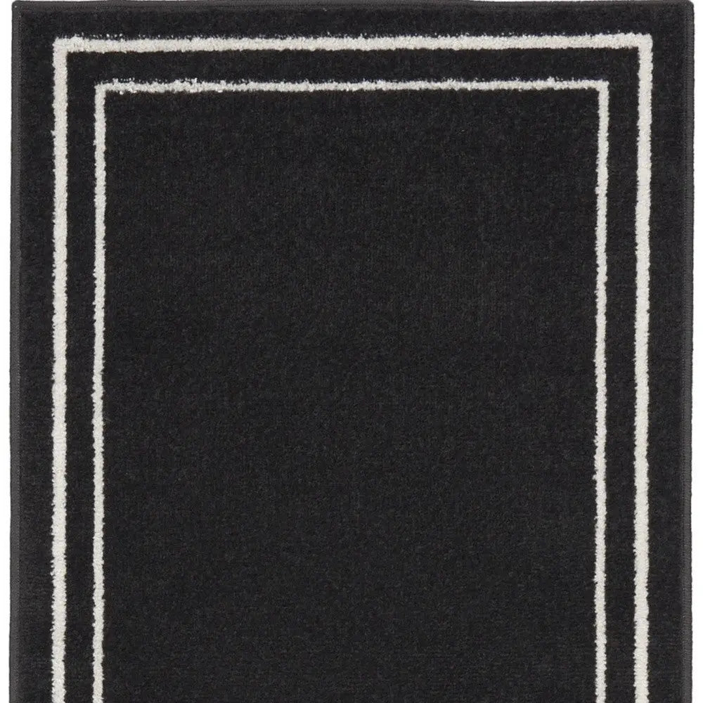 6' Black And Ivory Indoor Outdoor Runner Rug Homeroots Outdoor
